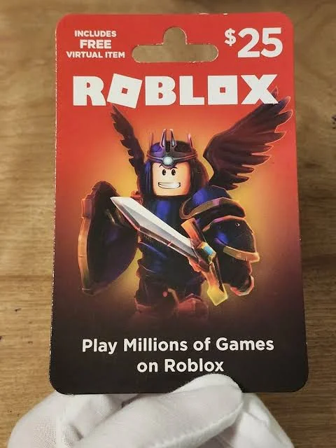 Photograph of Roblox gift card packaging showing a $25 printed value